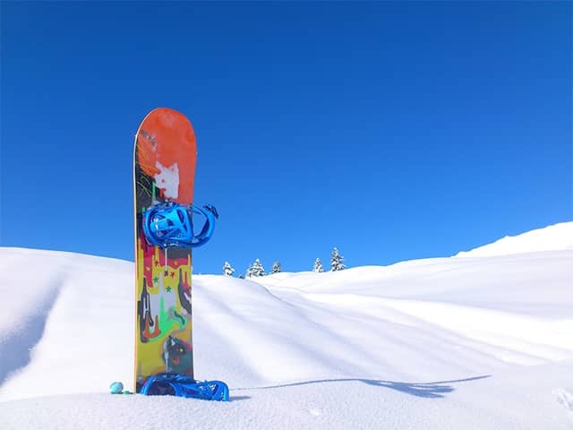 Snowboard stuck in the snow